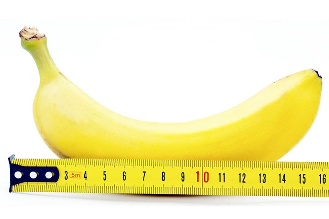 en banan med linjal symboliserar mätningen av penis efter operationen